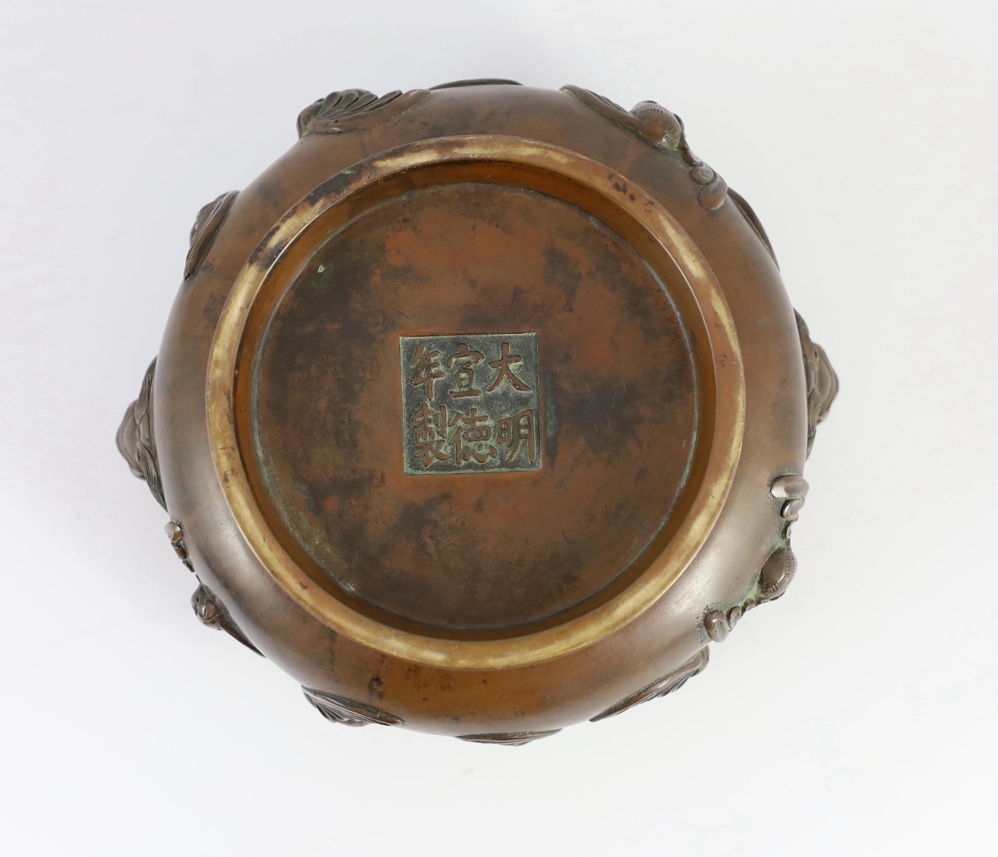 A large Chinese bronze ding censer, the wood cover with pale celadon jade finial, 22cm across